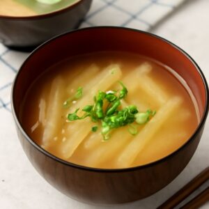 A bowl of vegan miso soup with fresh ingredients, showcasing a delicious vegetarian miso soup recipe