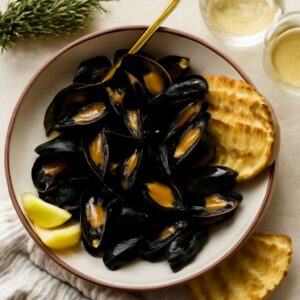 Delicious clams in white wine sauce and mussels in white wine cream sauce