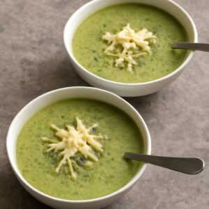 Cup of soup and healthy cream of broccoli soup